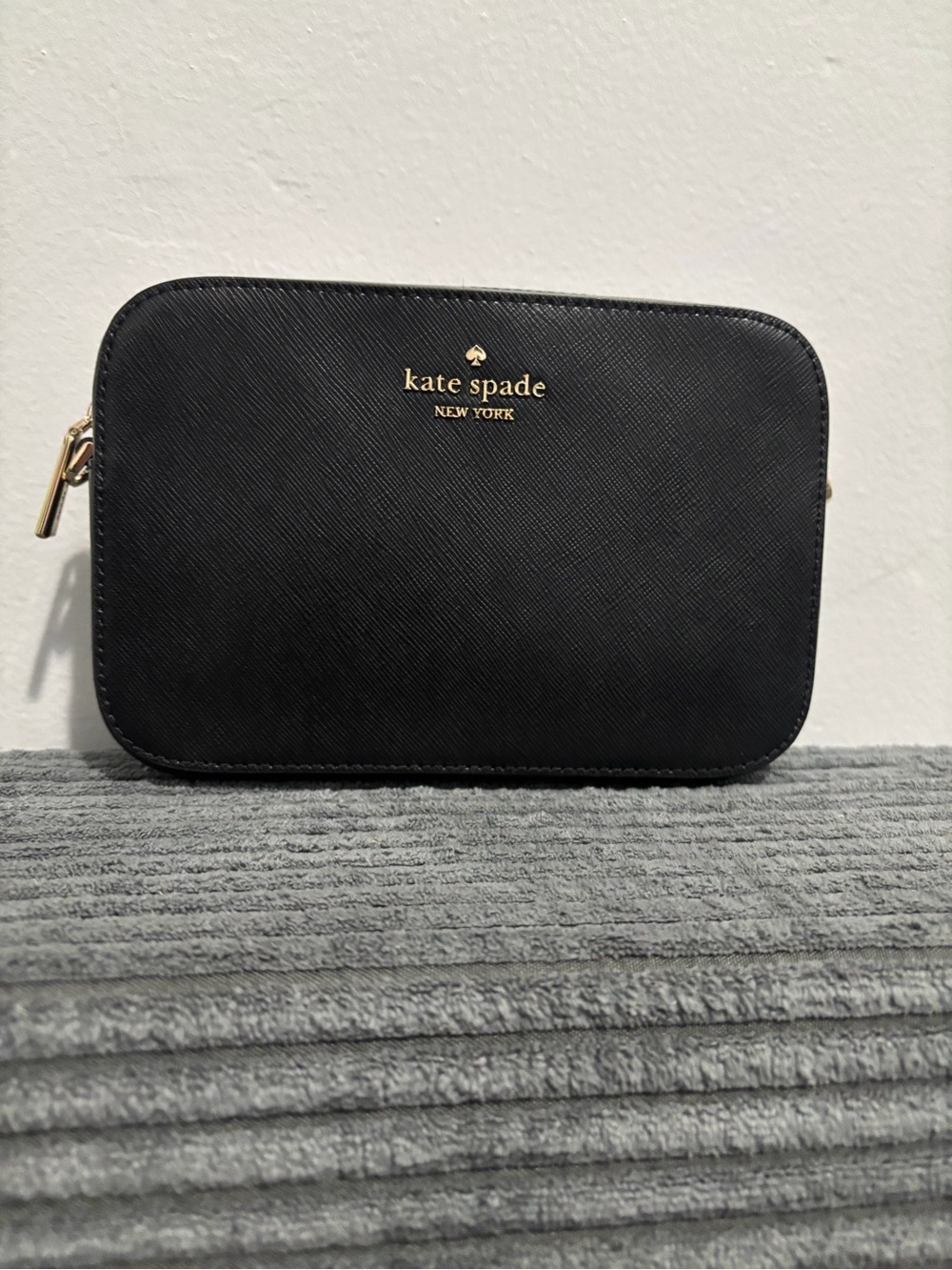 kate spade black saffiano cosmetic pouch with gold logo